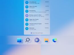 Detailný záber na spodnú časť plochy Windows 11: zoznam nedávnych konverzácií v appke Chat s odkazom Open Microsoft Teams a pod ním veľké ikony panela úloh Štart, Hľadanie, Chat, Prieskumník a Edge.