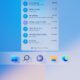 Detailný záber na spodnú časť plochy Windows 11: zoznam nedávnych konverzácií v appke Chat s odkazom Open Microsoft Teams a pod ním veľké ikony panela úloh Štart, Hľadanie, Chat, Prieskumník a Edge.